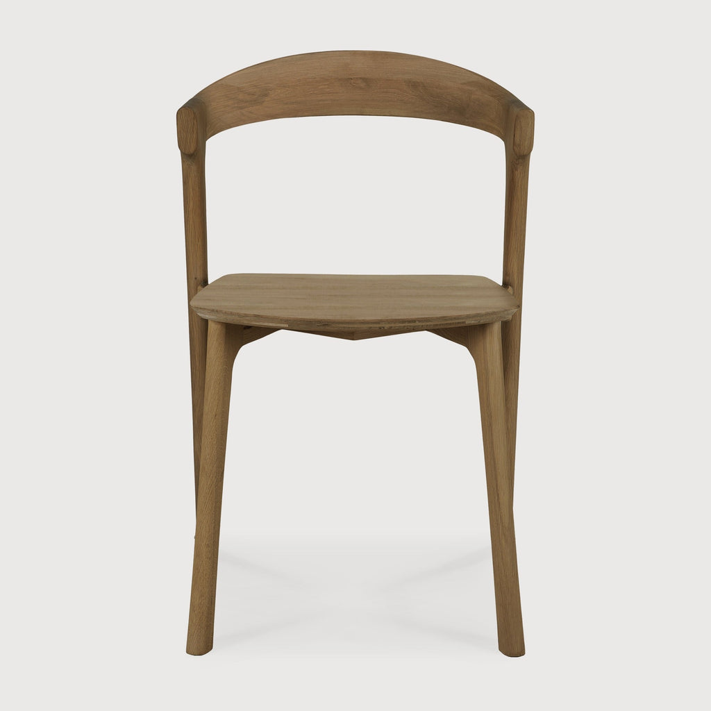 Bok Dining Chair in natural teak with contoured frame and clean lines