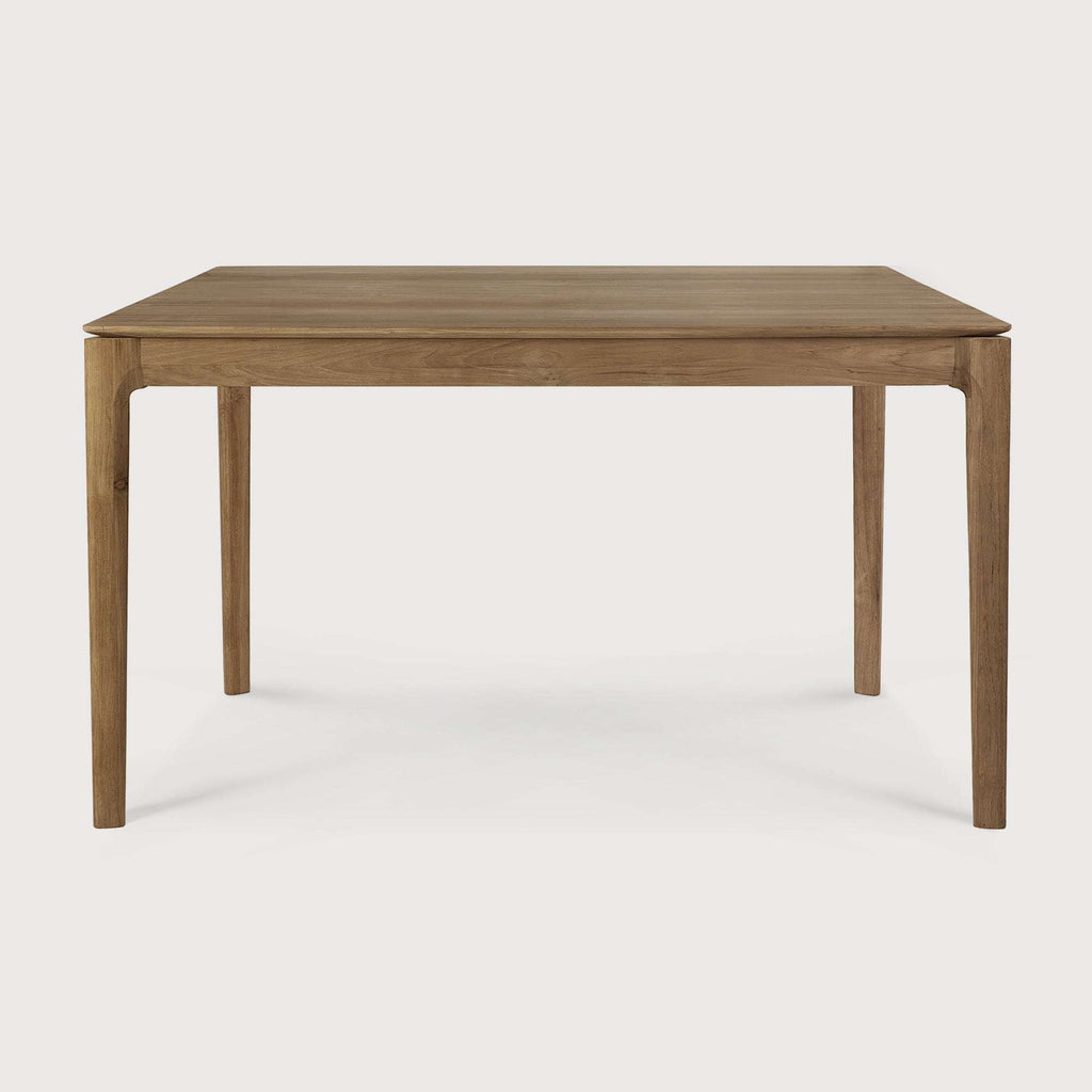 Bok Dining Table in natural teak with contoured frame and floating top, handcrafted in Indonesia