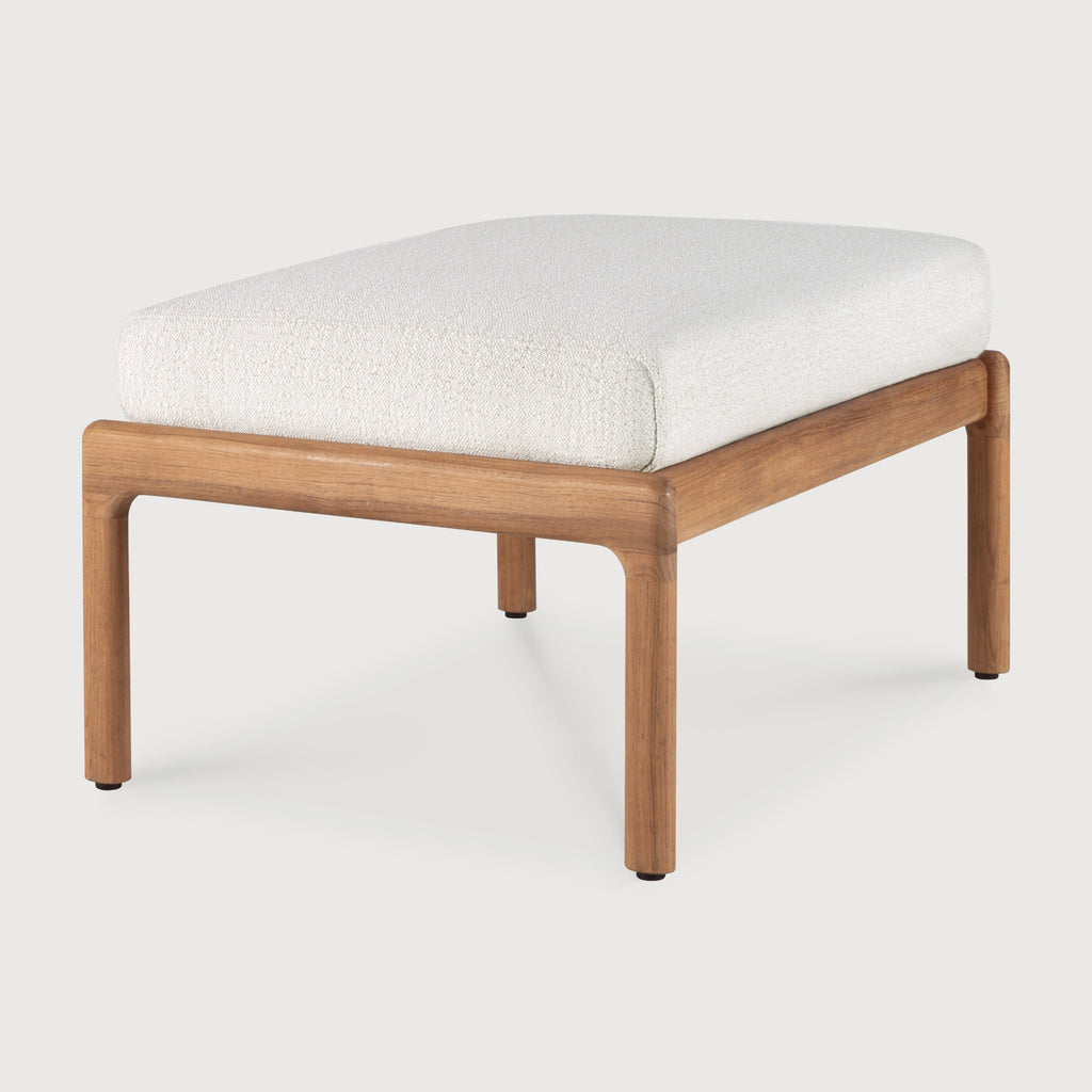 Wooden ottoman with a white cushion on a light gray background