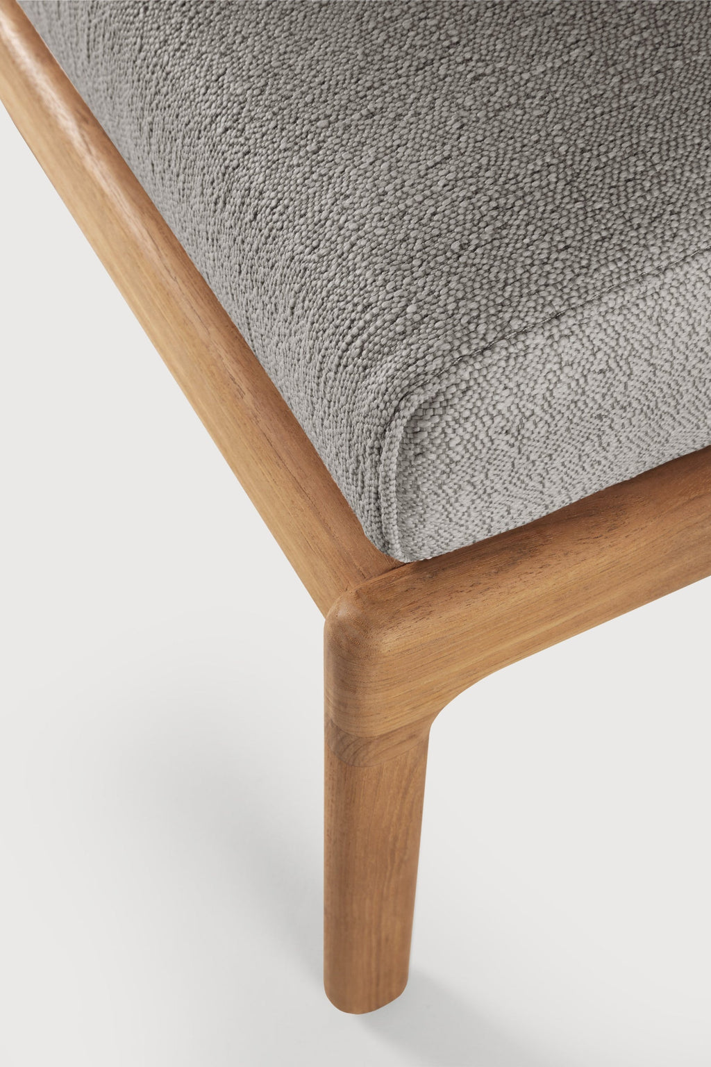 Jack Outdoor Footstool in solid teak with subtle curves and timeless design for elevated outdoor relaxation