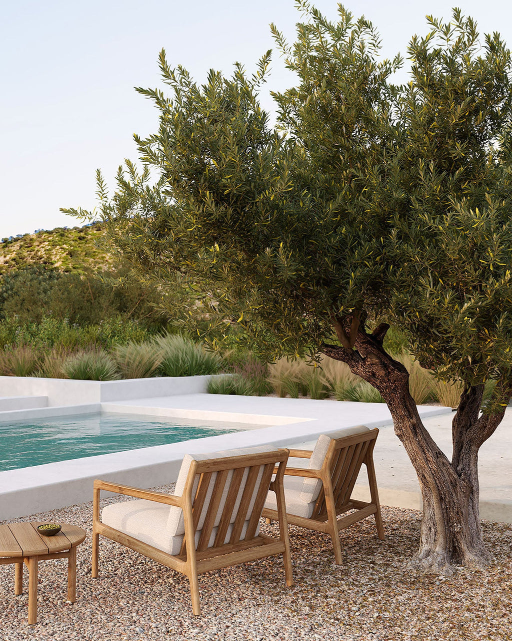 Quatro Outdoor Side Table with grooved teak tabletop and round legs in modern outdoor setting