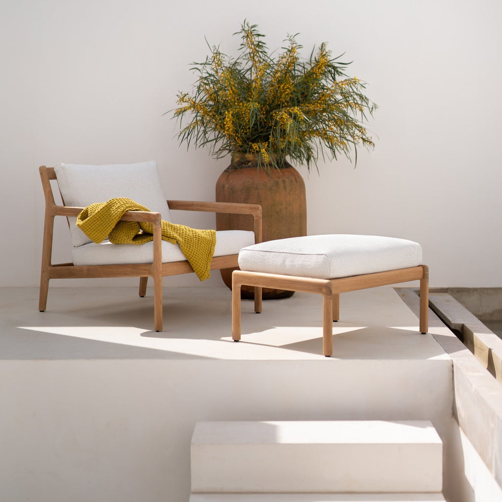 Jack Outdoor Footstool in solid teak with organic curves for stylish outdoor seating