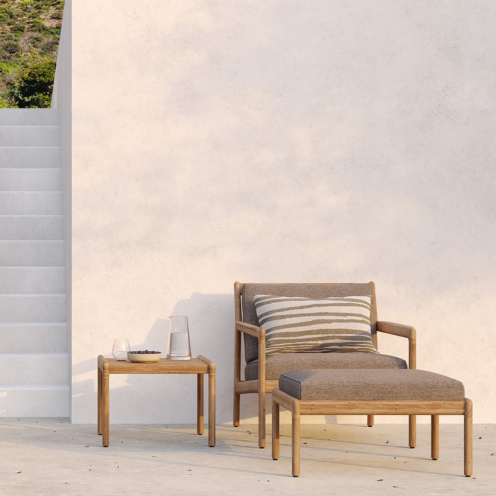 Jack Outdoor Footstool in solid teak with elegant curved design for outdoor relaxation