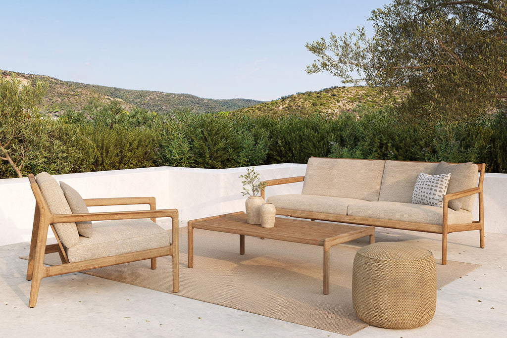 Jack Outdoor Lounge Chair in solid teak with timeless curved design for stylish outdoor relaxation