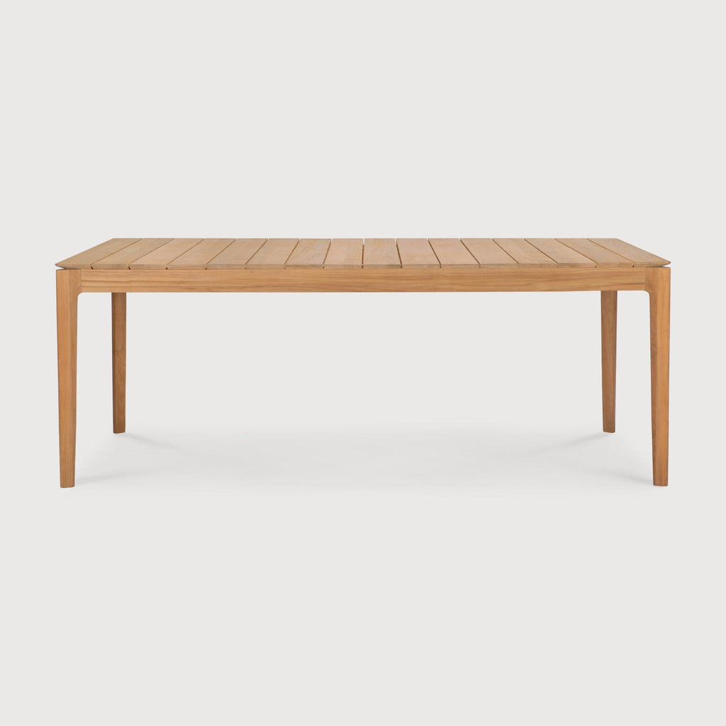 Bok Outdoor Dining Table crafted from teak with sculptural design and slatted tabletop