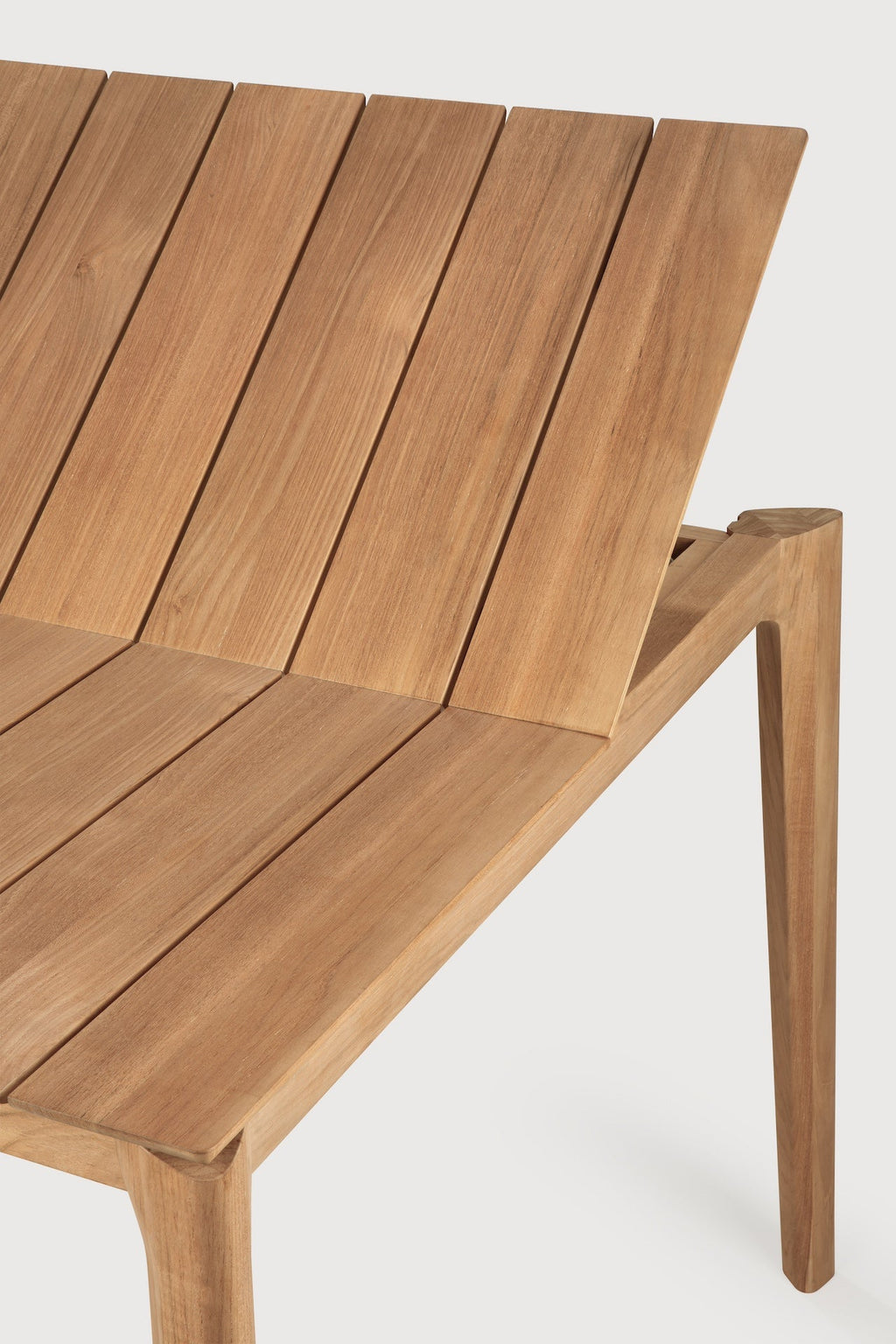 Bok Outdoor Extendable Dining Table in teak with floating slatted top and sculptural frame