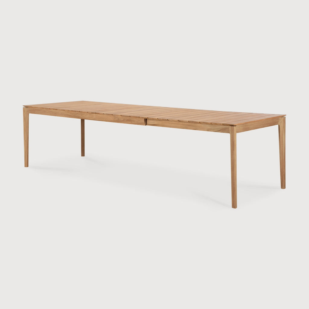 Bok Outdoor Extendable Dining Table in teak with slatted top and contoured frame, extending from 79 to 118.5 inches for 8 to 12 people seating outdoors