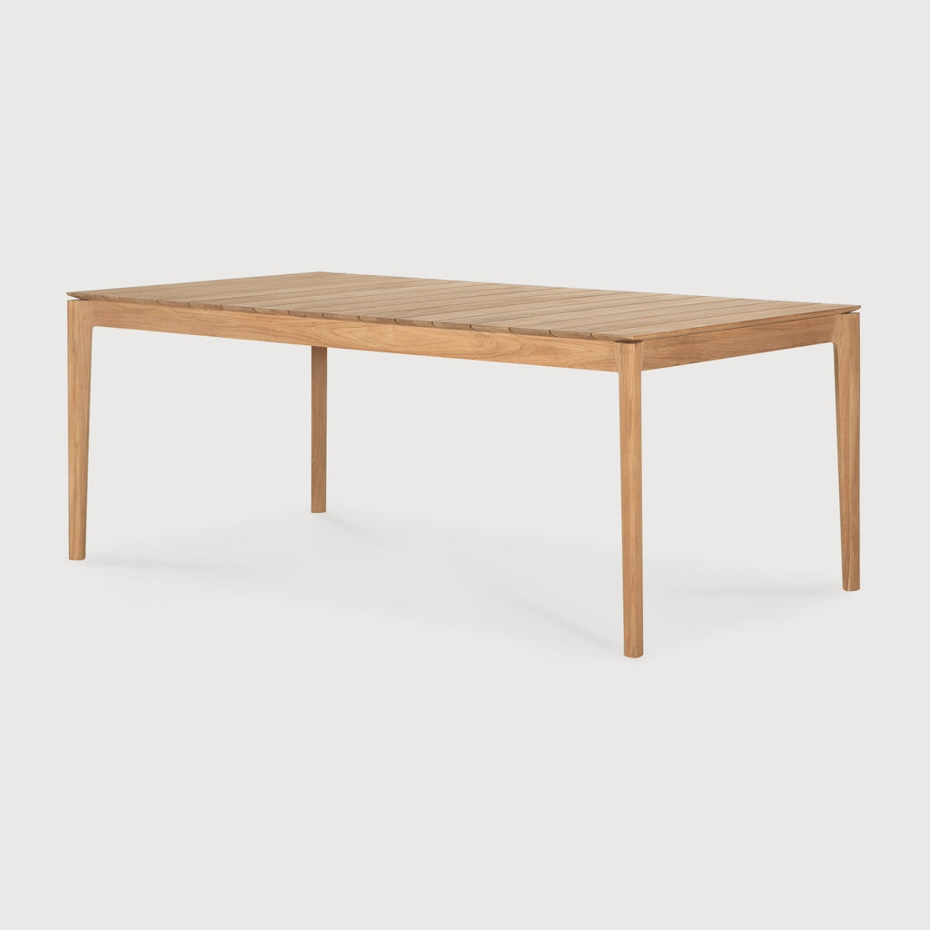 Bok Outdoor Extendable Dining Table made of teak with a sculptural, extendable slatted design seating up to 12 people