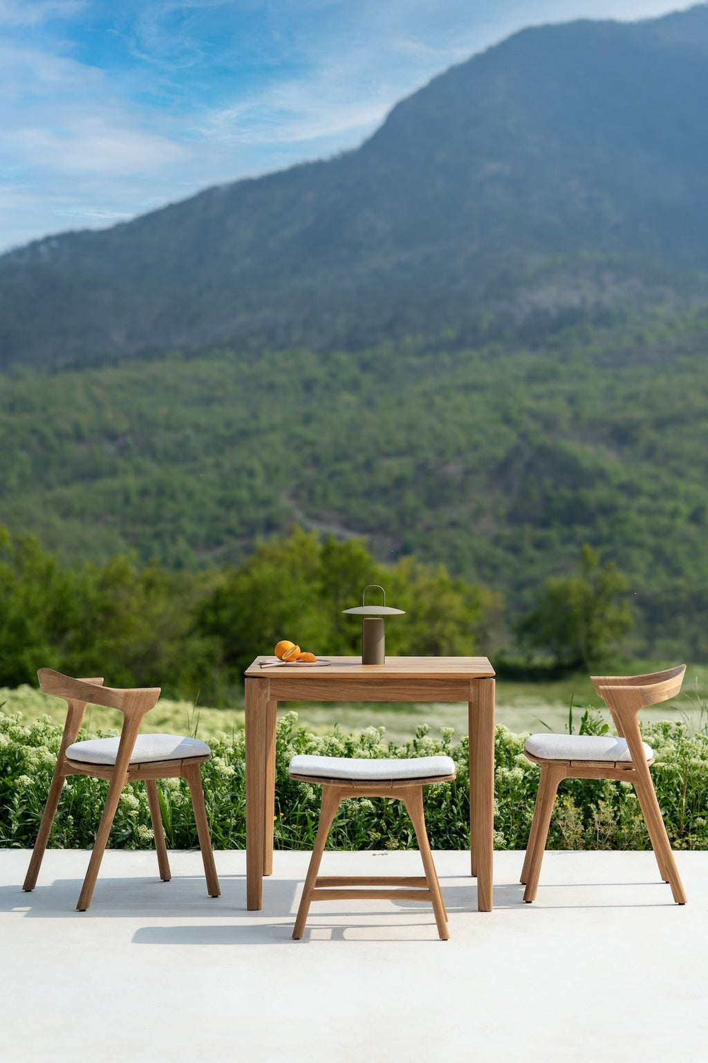 Bok Outdoor Dining Table made of teak with sculptural, slatted top and airy modern design