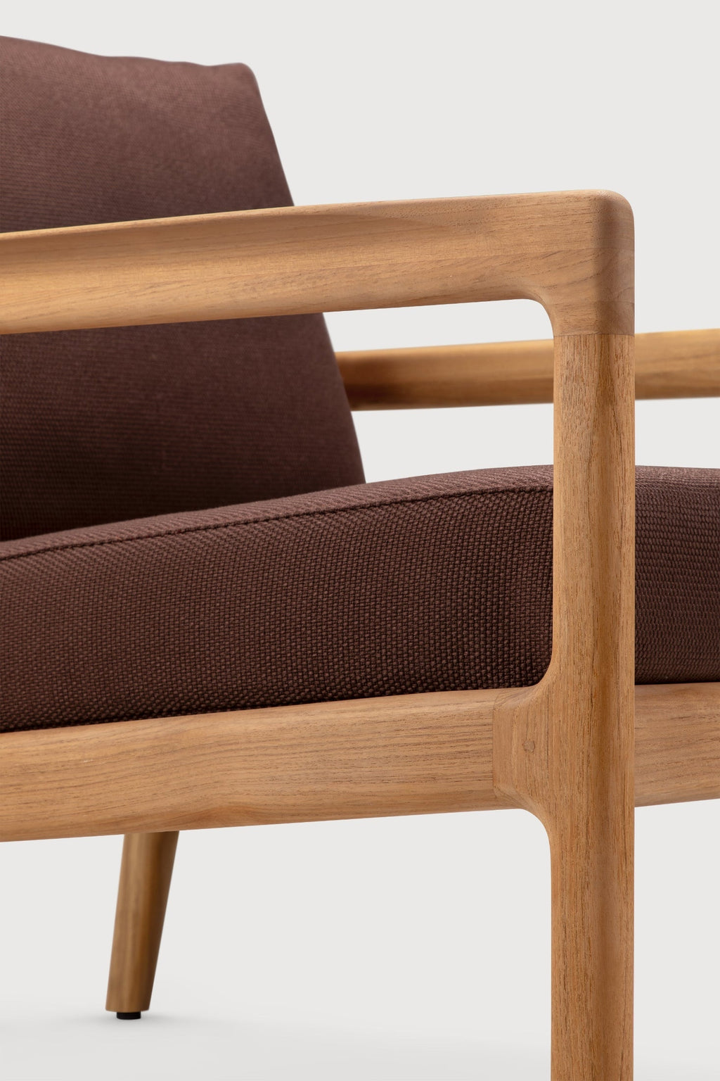 Jack Outdoor Lounge Chair made of solid teak with curved design for stylish outdoor relaxation