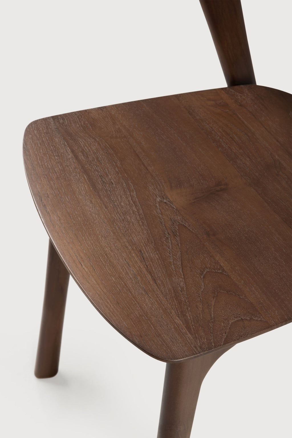 Bok Dining Chair in dark teak with contoured frame and brown varnished finish
