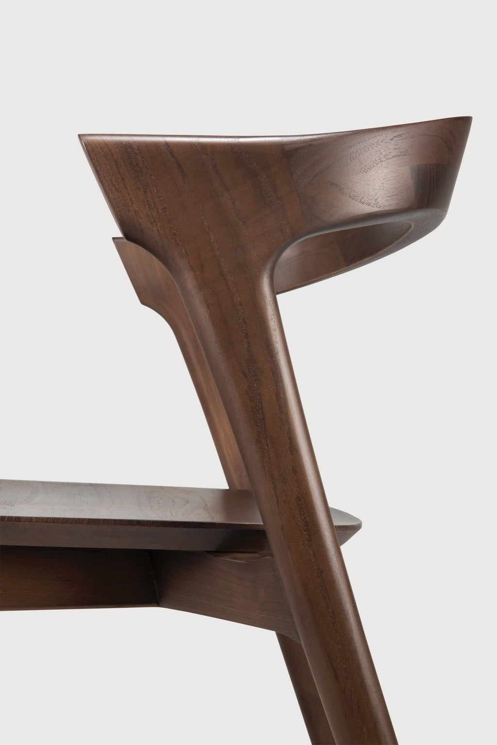 Bok Dining Chair in dark teak with contoured frame and brown varnished finish