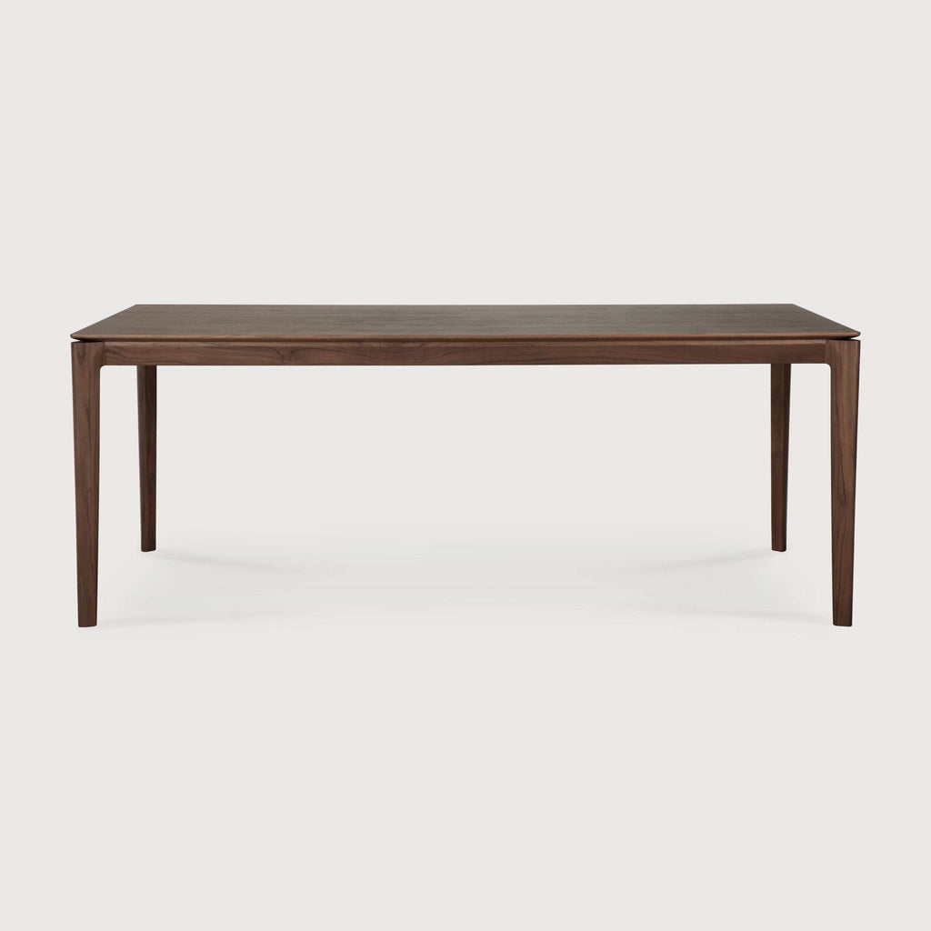Bok Dining Table in dark teak with contoured frame and floating top, handcrafted from solid natural teak