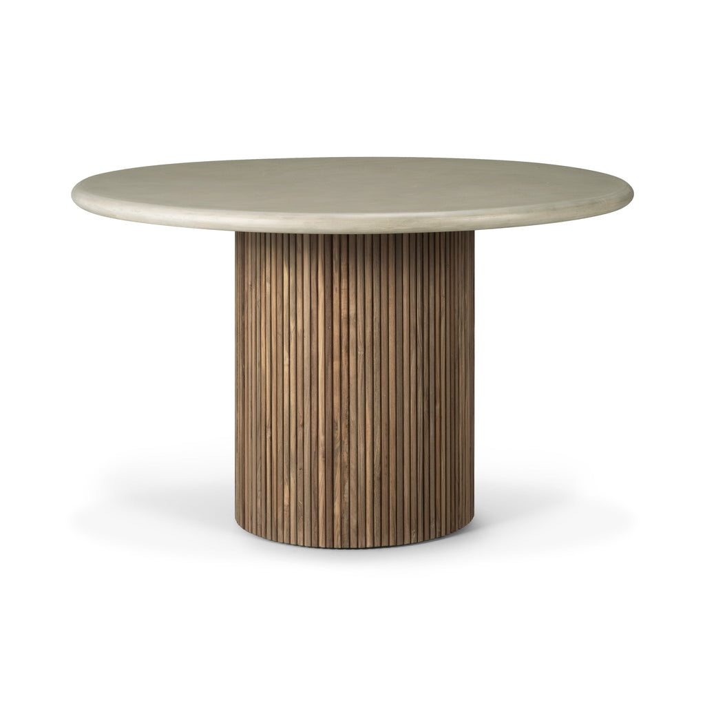 Roller Max Outdoor Dining Table with stacked wood-stick base and hand-finished concrete top