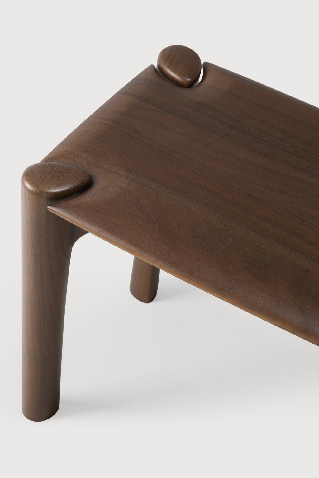 Dark teak PI Bench with sculpted base and curved edges, handcrafted from solid teak wood