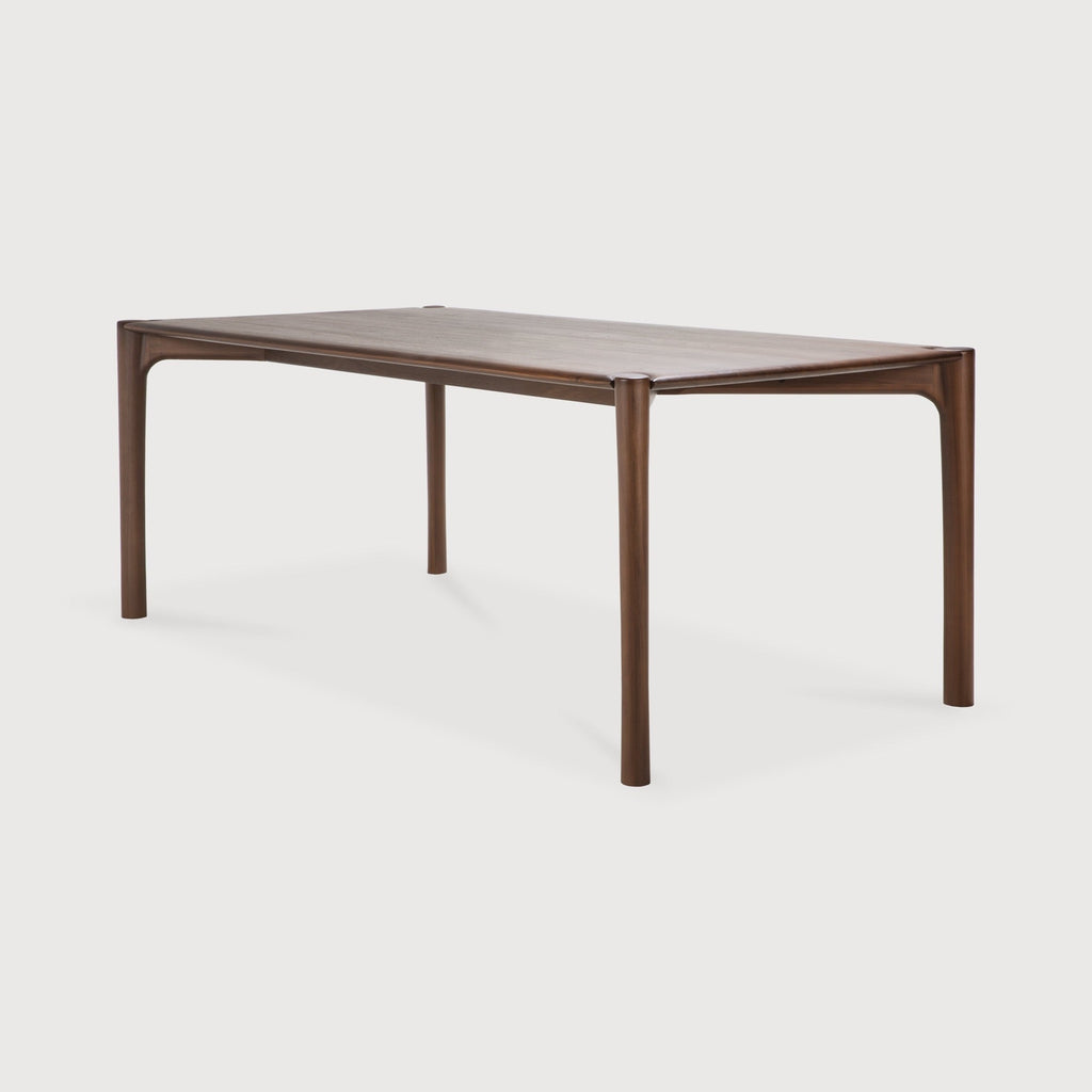 Dark teak PI Dining Table with sculpted base and curved edges, handcrafted in Indonesia