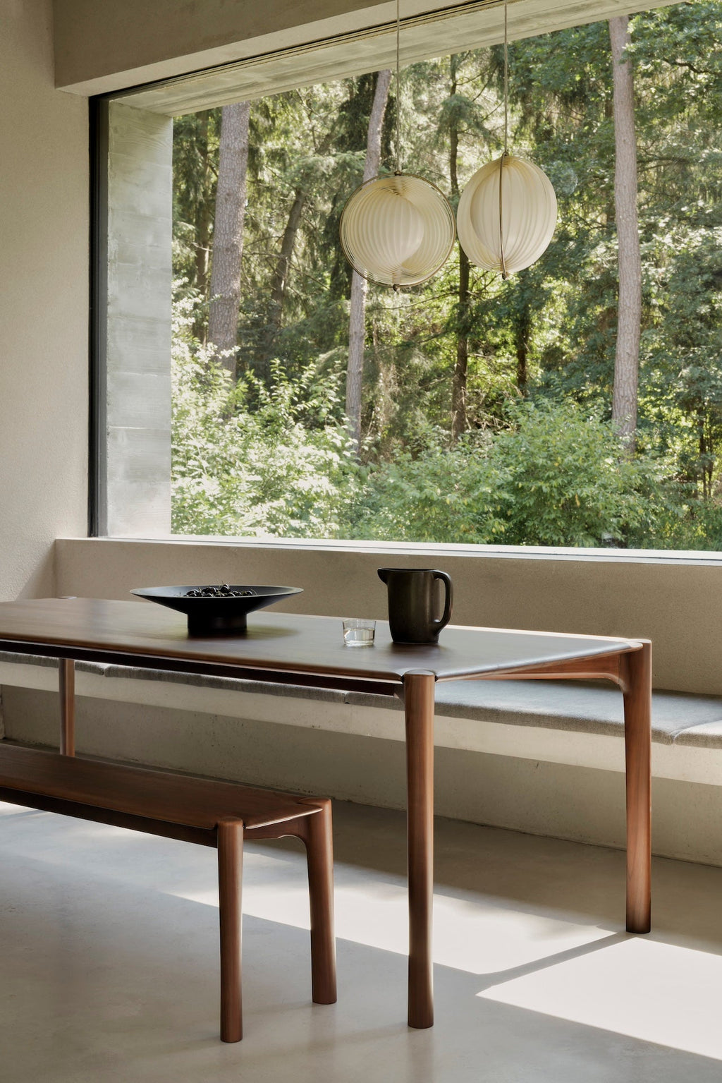 PI Bench in dark teak with modern silhouette and sculpted base, handcrafted solid teak wood