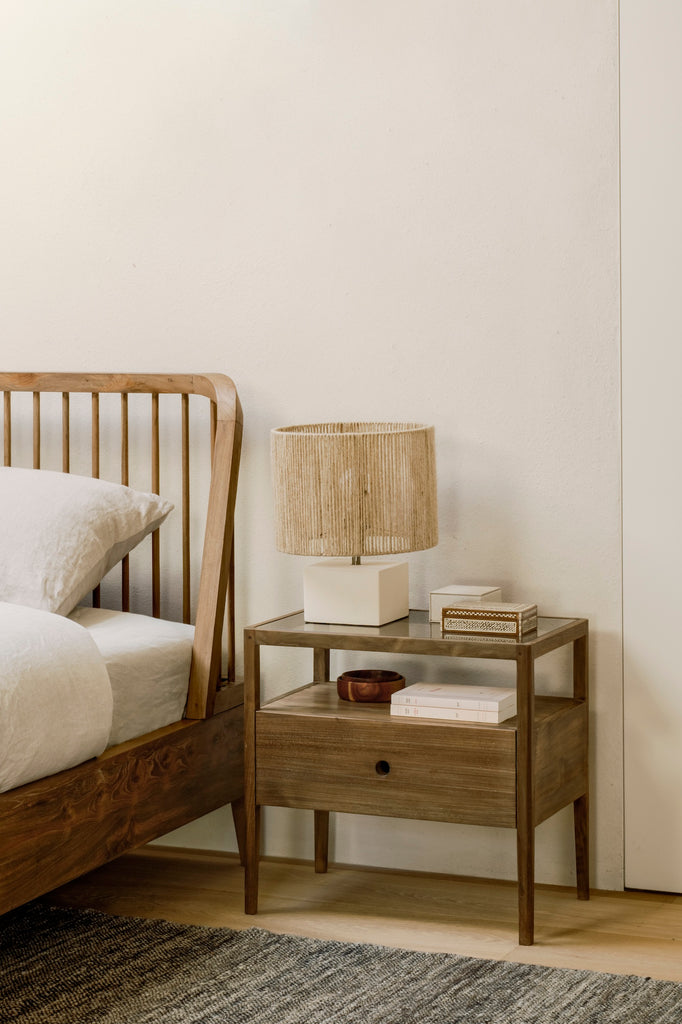 Solid hand-finished reclaimed teak wood bedside table with one drawer, glass top and slightly tapered legs - pictured with Mendocino bed - Saffron and Poe, Ethnicraft