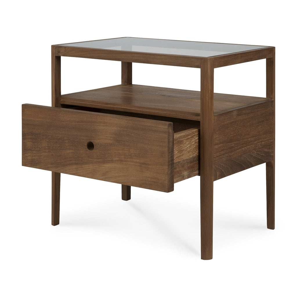 Spindle bedside table in dark teak with glass top, single drawer, and open shelf in coastal modern style