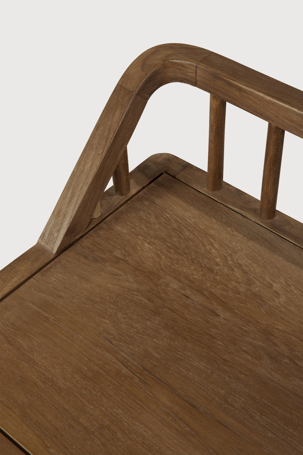Dark teak Spindle Bench with low spoked back and spacious seat in European white oak, coastal modern design