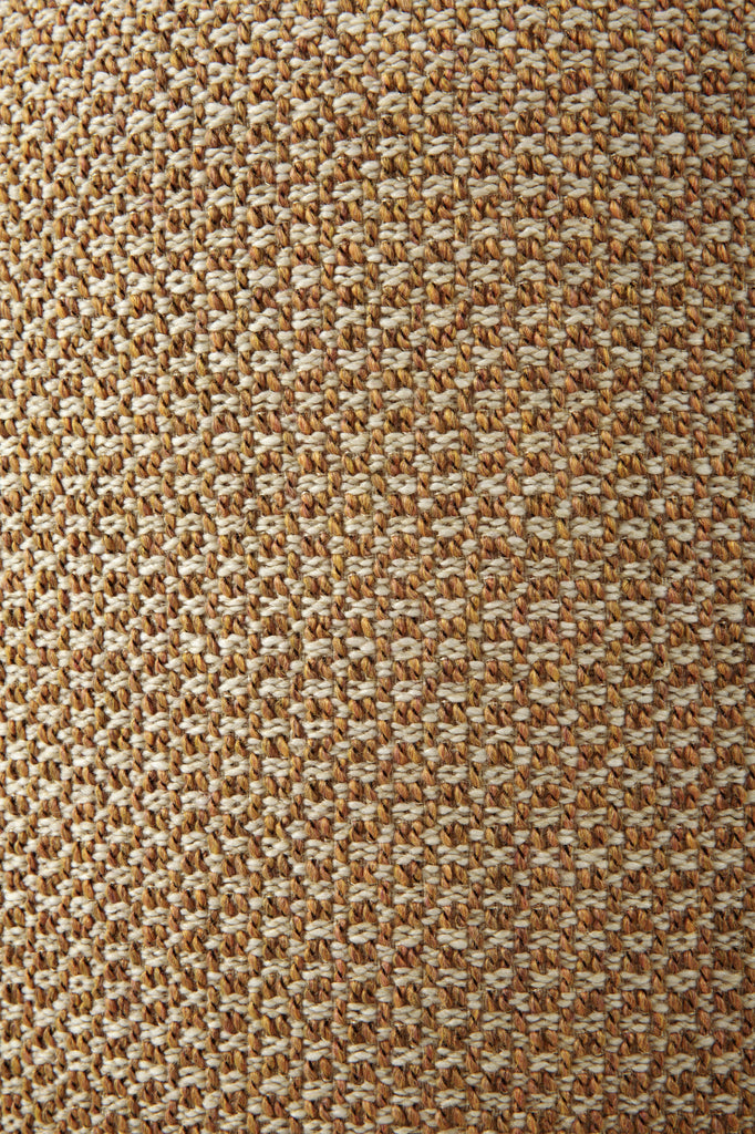 Close-up of a textured brown fabric surface