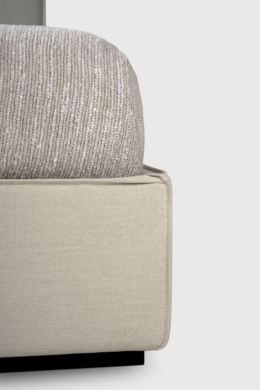 Revive Bed in sand linen upholstery with cushioned headboard and stitched seams for a luxurious, practical bedroom retreat