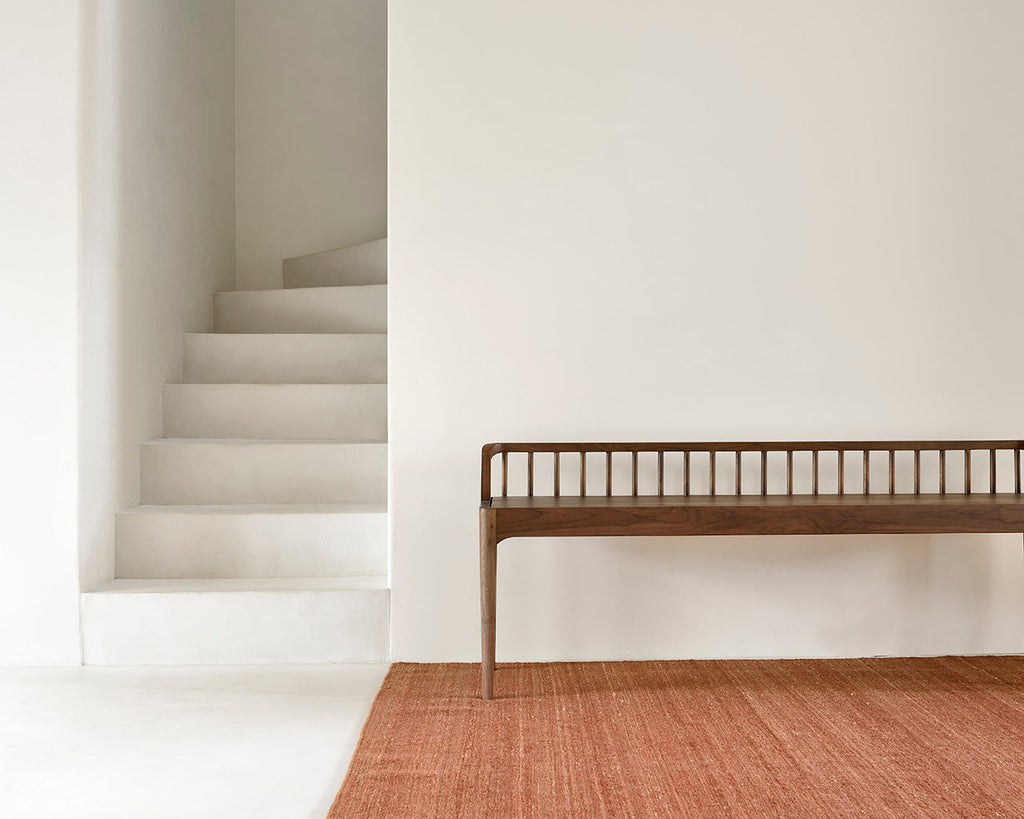 Dark teak spindle bench with low spoked back and spacious seat, crafted from European white oak