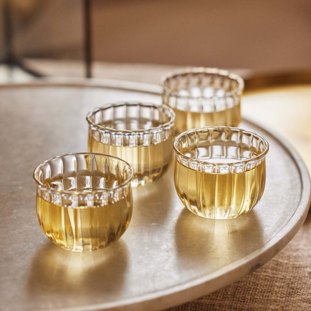 Set of 4 hand-blown Kira small glass cups with wave-like rim for tea or sake