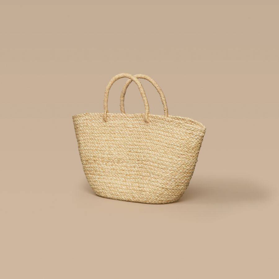 Handwoven natural braided raffia tote bag with sturdy handles, lightweight and durable daily carry accessory