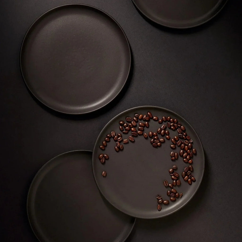 Tunisian 12pc matte black stoneware dinnerware set with handmade dinner plates, side plates, and bowls