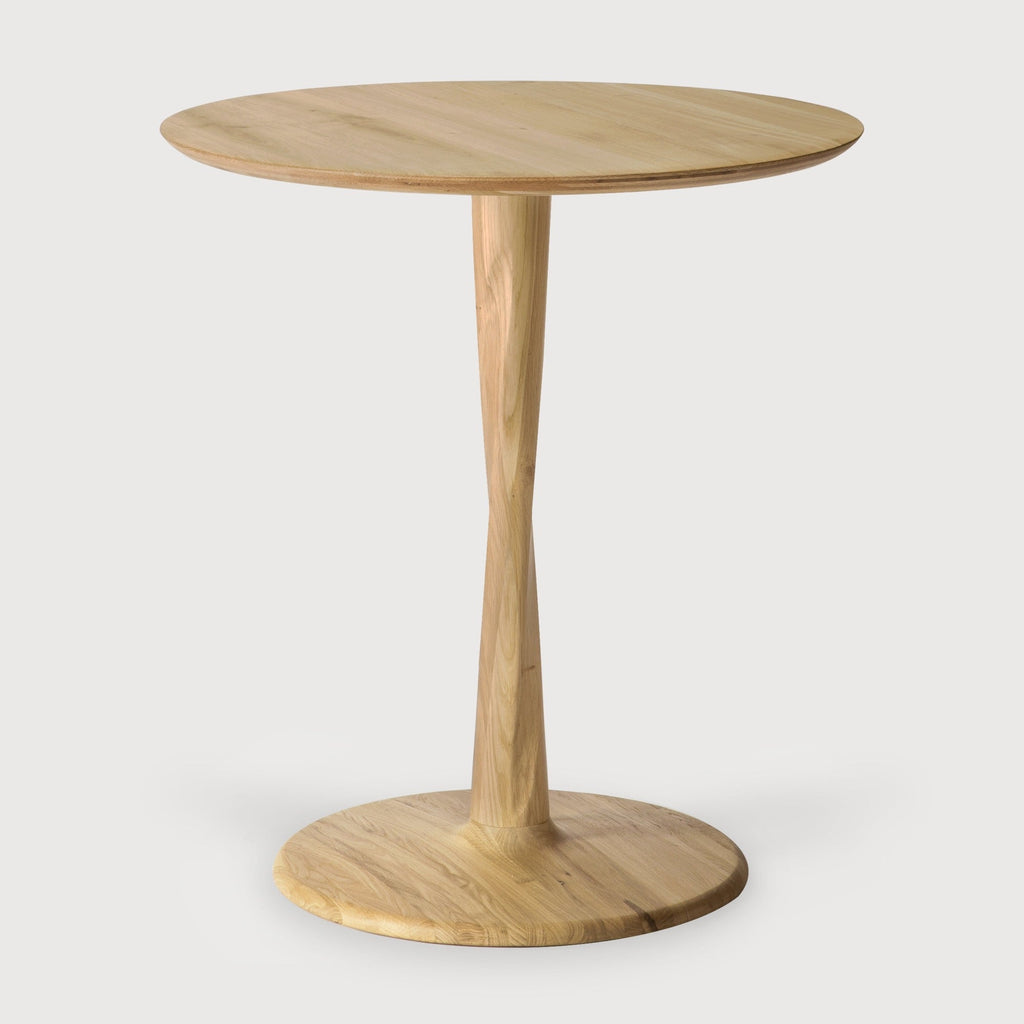 Torsion Dining Table in white oak with round top and sculptural twisted pedestal base