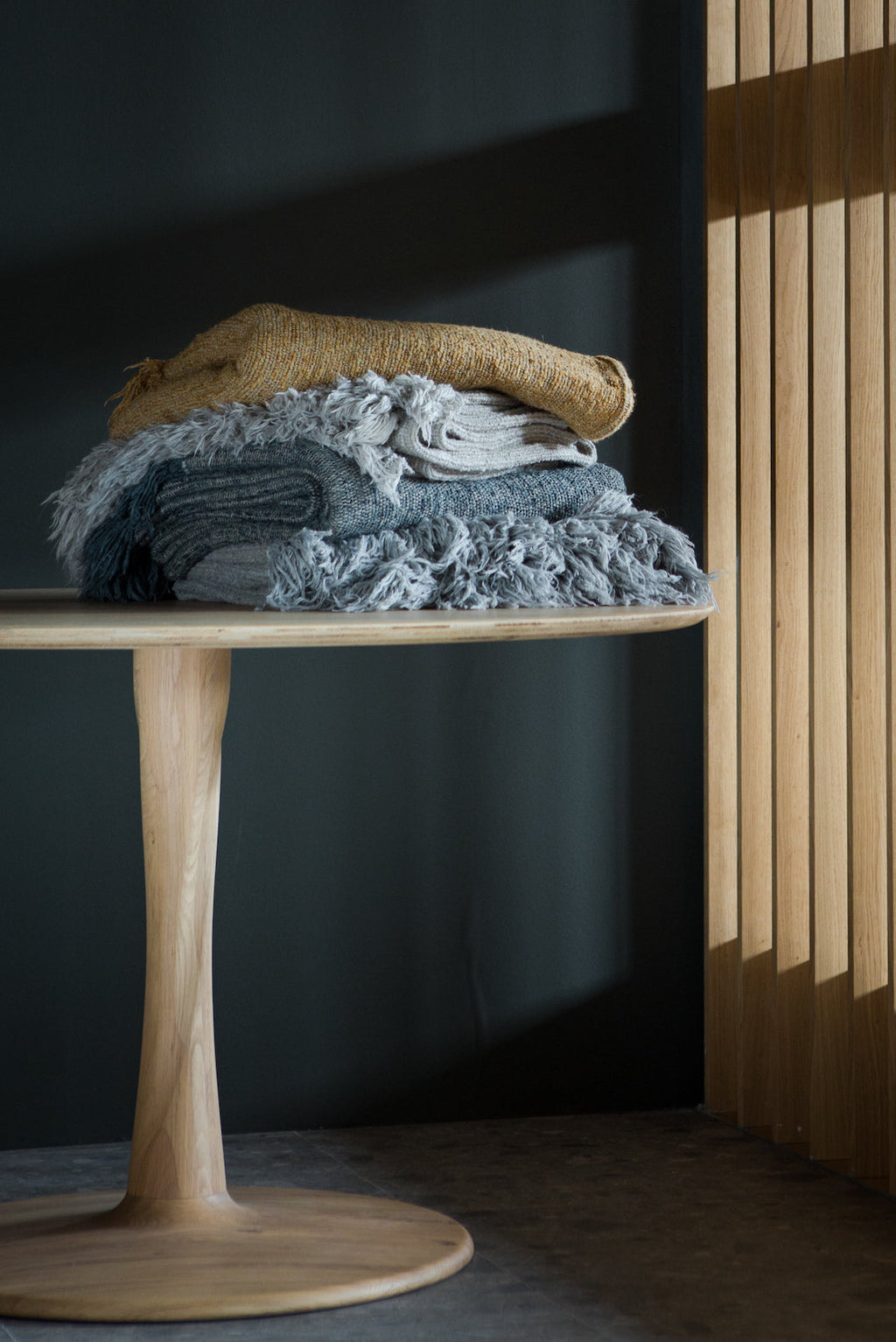 Torsion Dining Table with white oak round top and sculptural twisted base