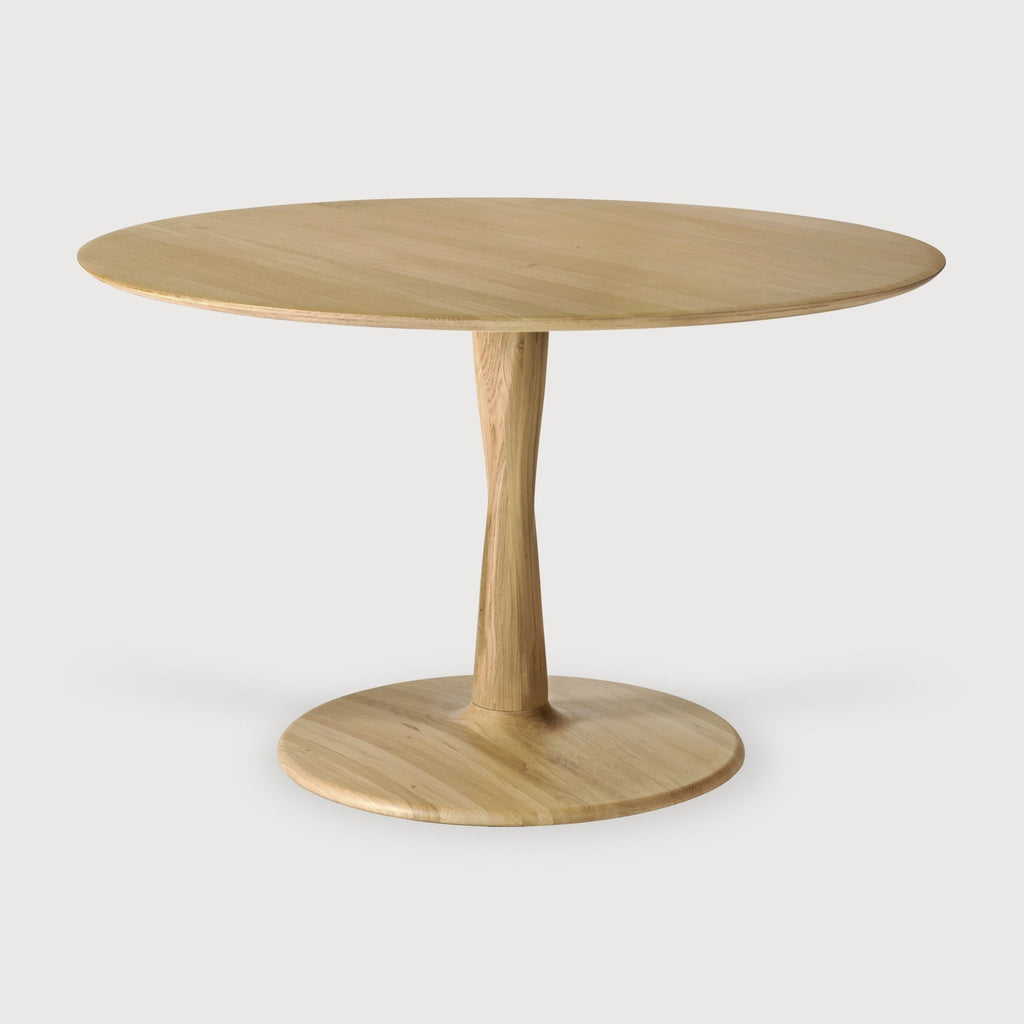 Torsion Dining Table in white oak with round top and sculptural twisted pedestal base