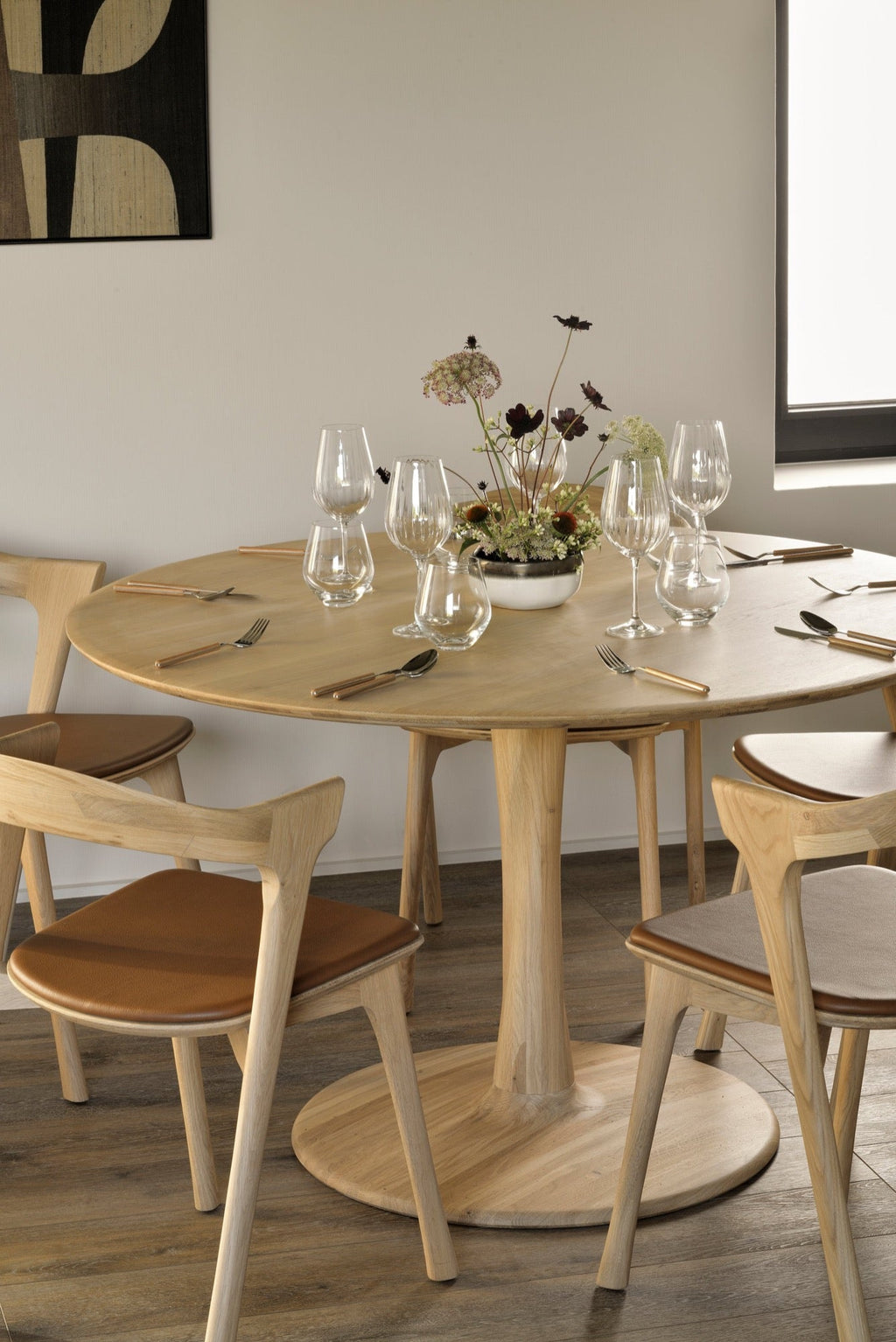 Torsion Dining Table in white oak with round top and sculptural twisted base