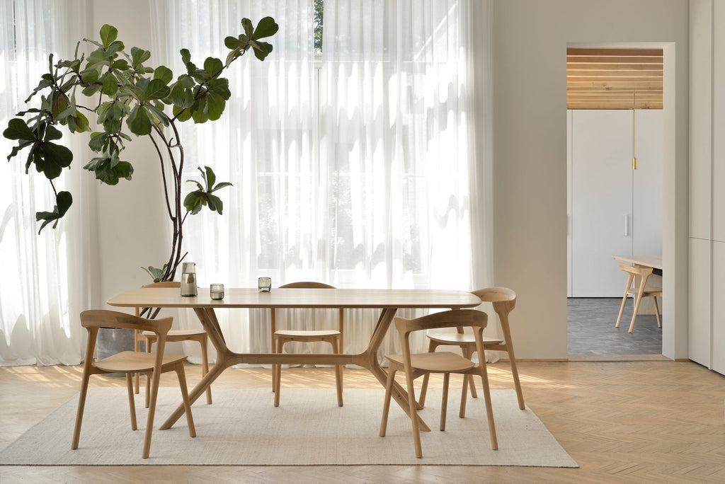 Modern X Dining Table made of solid European white oak with contoured base and oiled finish