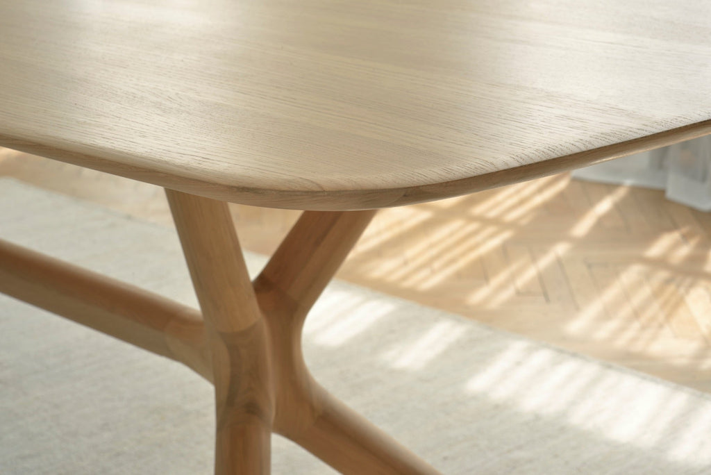 X Dining Table in white oak with contoured base and smooth tabletop, crafted from solid European white oak with oiled finish