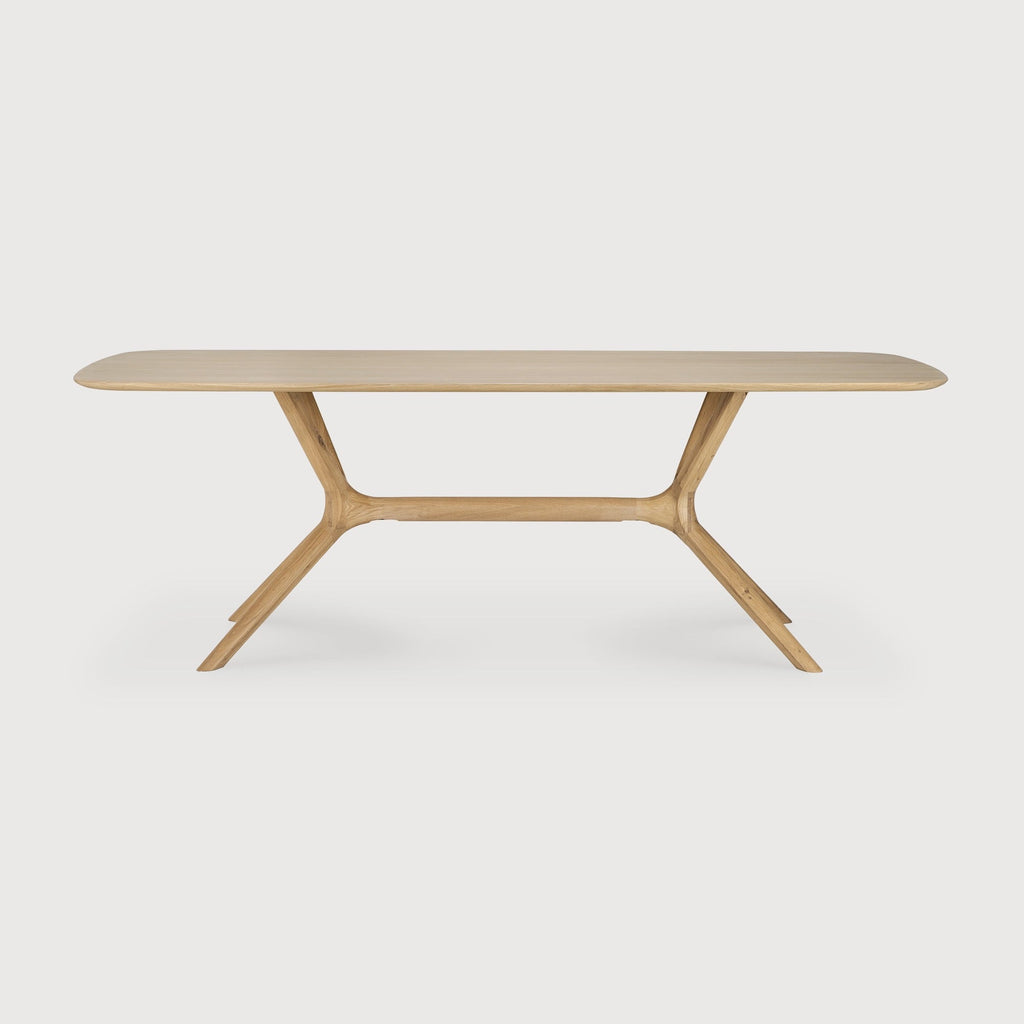 Modern X Dining Table in white oak with contoured base and smooth tabletop design