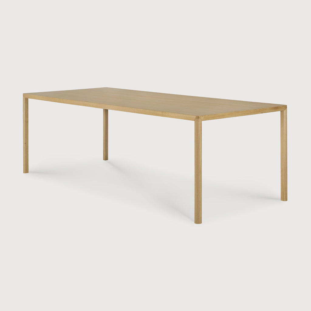 White Oak Air Dining Table side angle with white background and beautiful wood detailing. - Saffron and Poe, Ethnicraft