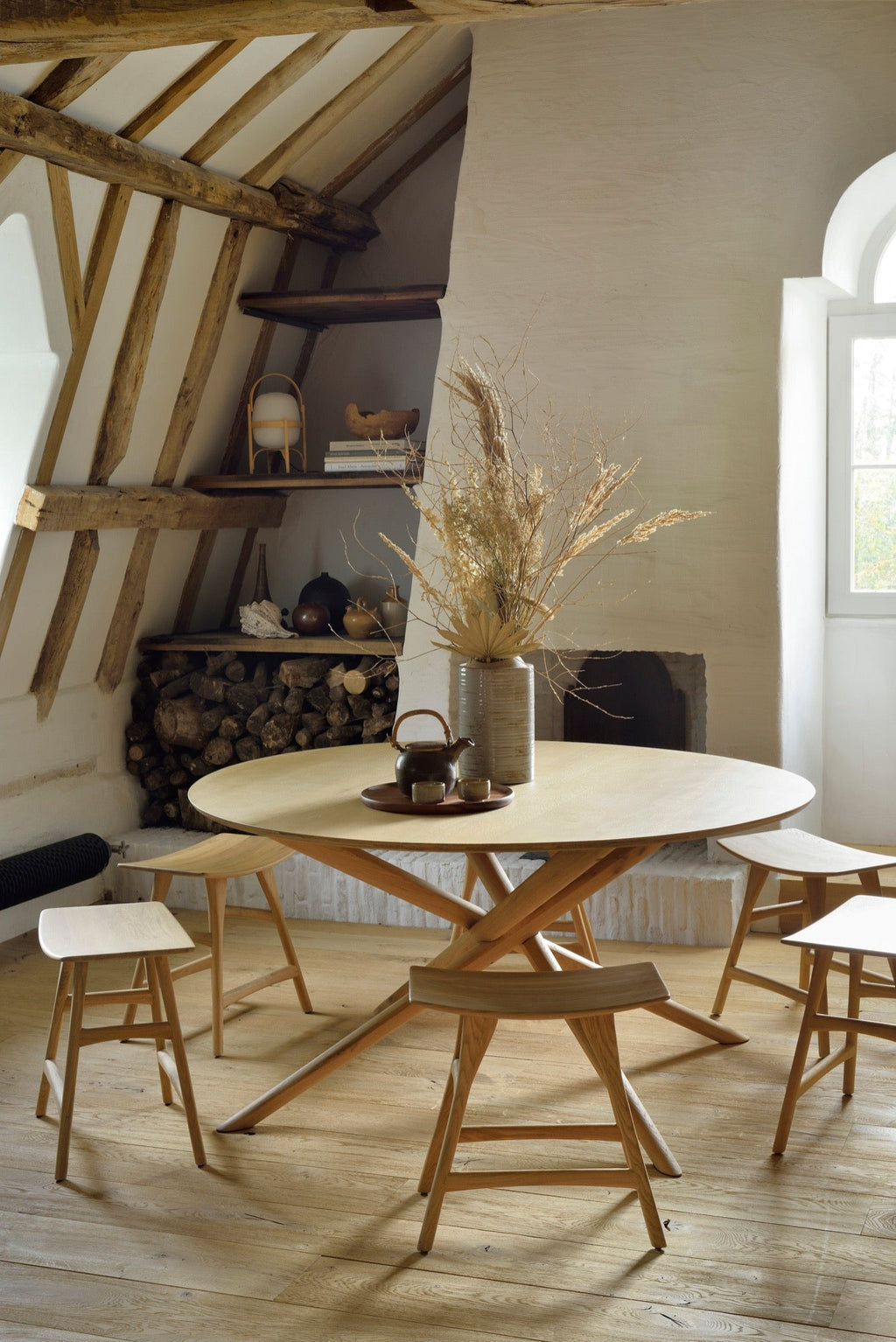 Mikado Round Dining Table in white oak with sculptural interlocking legs and modern organic design