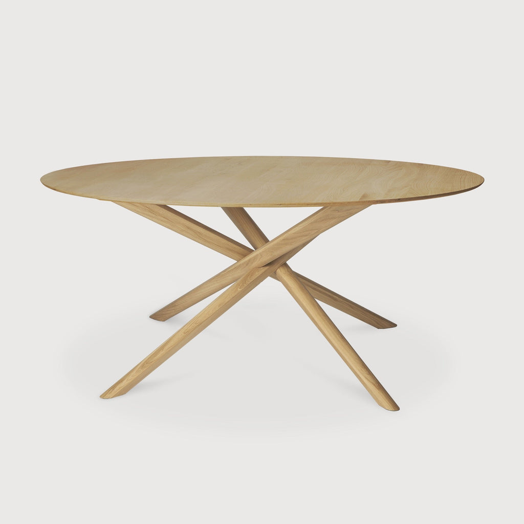 Mikado Round Dining Table in white oak with sculptural interlocking legs for cozy dining spaces