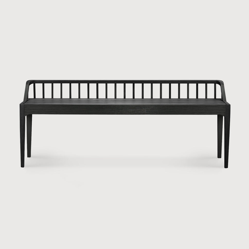 Black oak spindle bench with low spoked back and spacious seat in modern coastal style