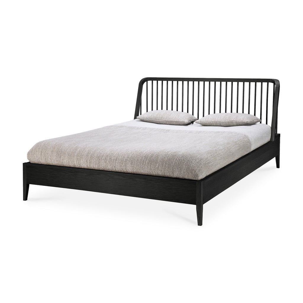 Black oak spindle bed with curved edges and Scandinavian coastal design in European white oak