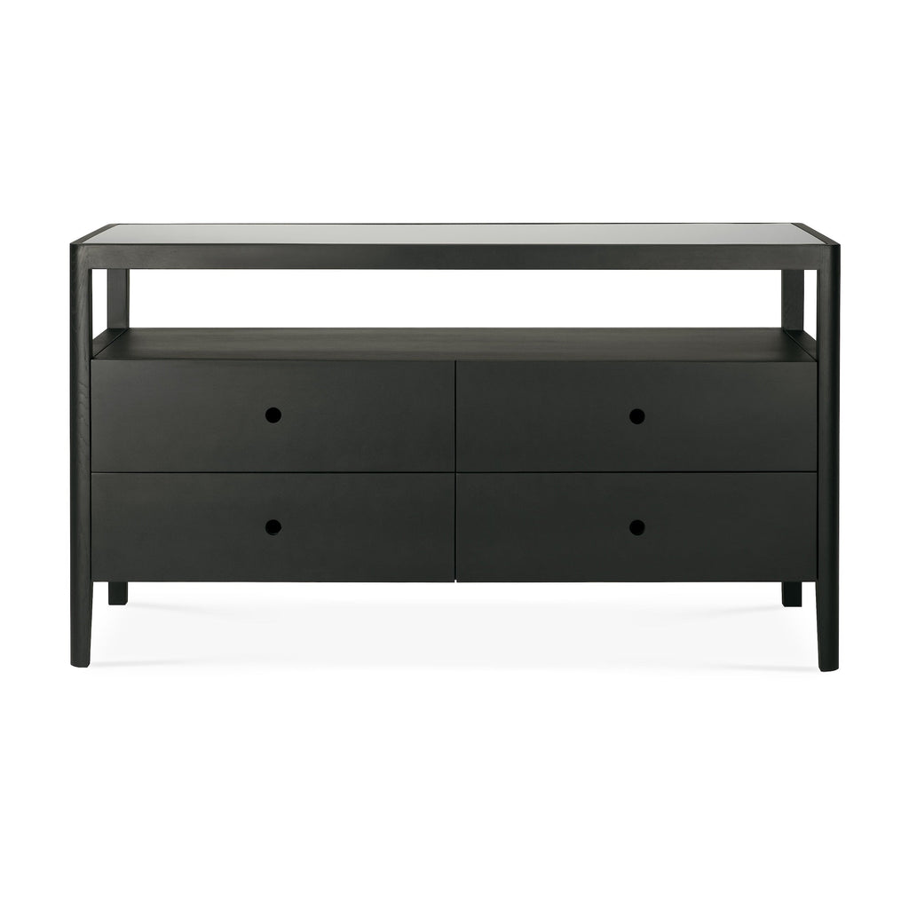 Black oak Spindle Dresser with four drawers, open shelf, and glass top in coastal modern style
