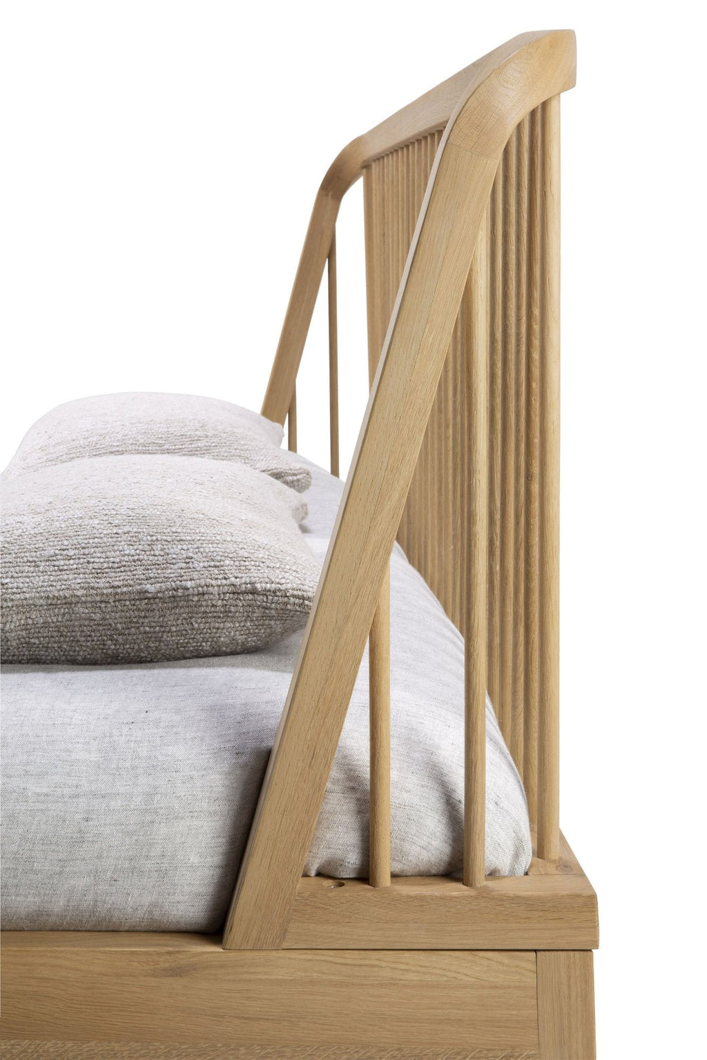 White oak spindle bed with curved edges and classic coastal design