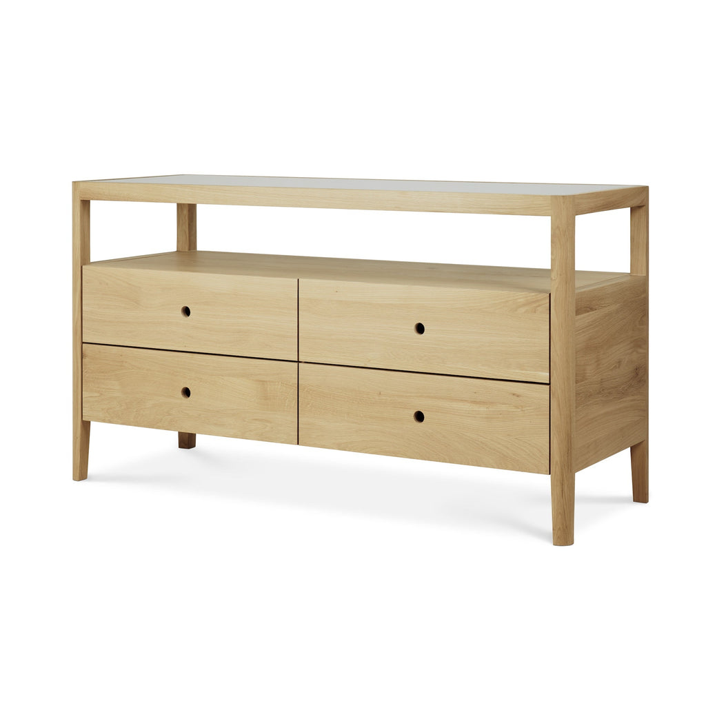 Spindle Dresser in European white oak with four drawers, open shelf, and glass top, featuring rounded edges and minimalist design.