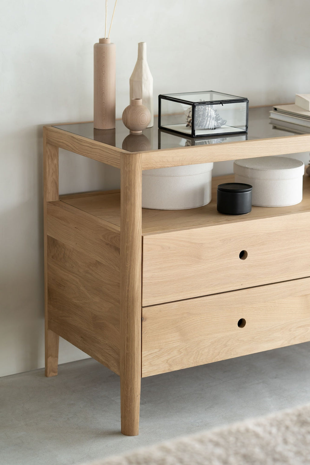 Spindle Dresser in oak with four drawers, open shelf, and glass top, featuring a coastal California spindle design.