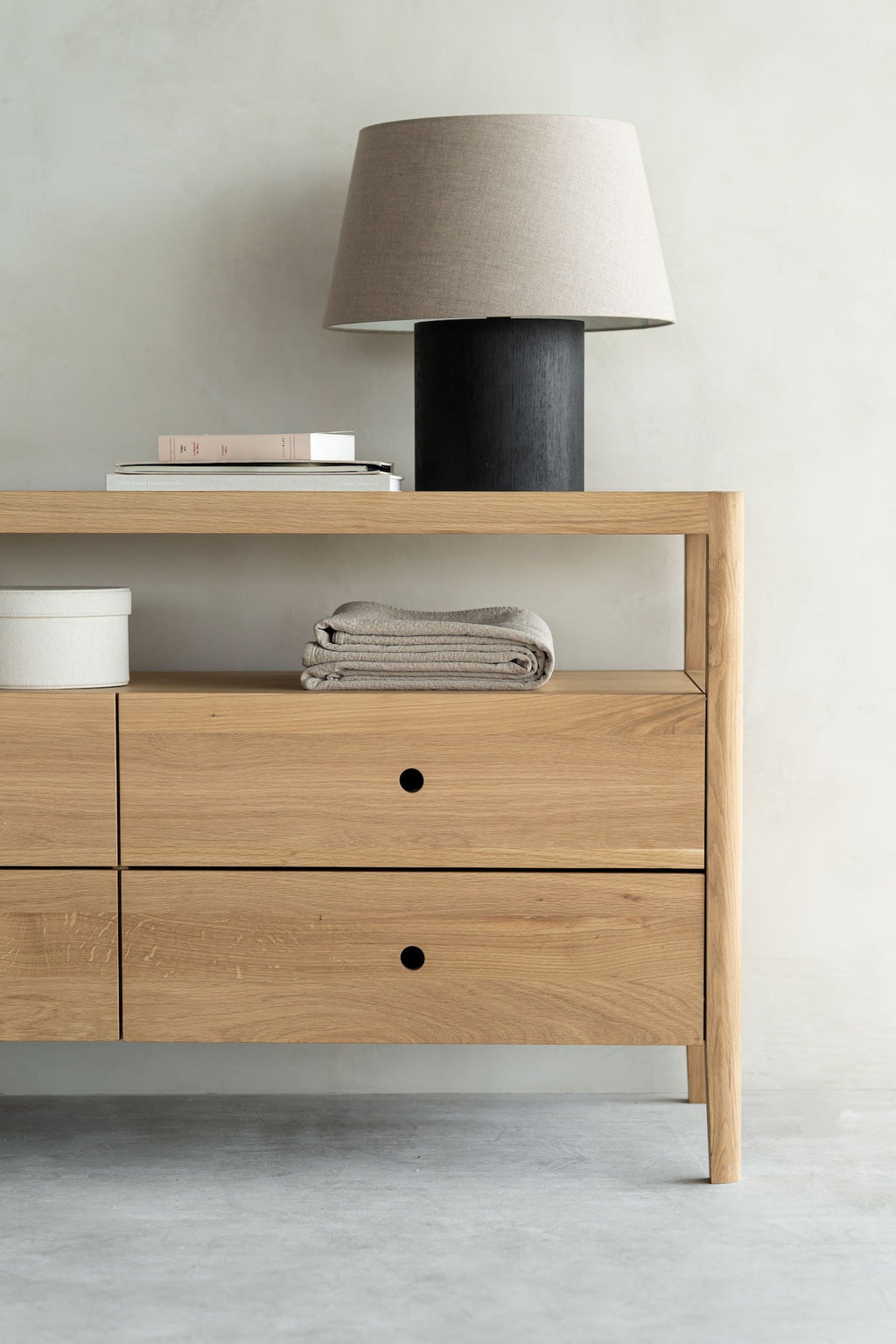 Oak Spindle Dresser with four drawers, open shelf, and glass top in coastal California style
