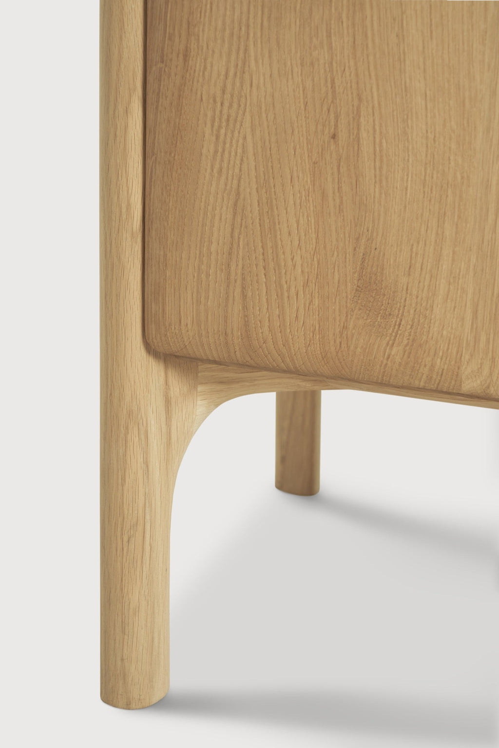 PI 2-Door Console in white oak with curved edges and sculpted base, modern design with practical storage