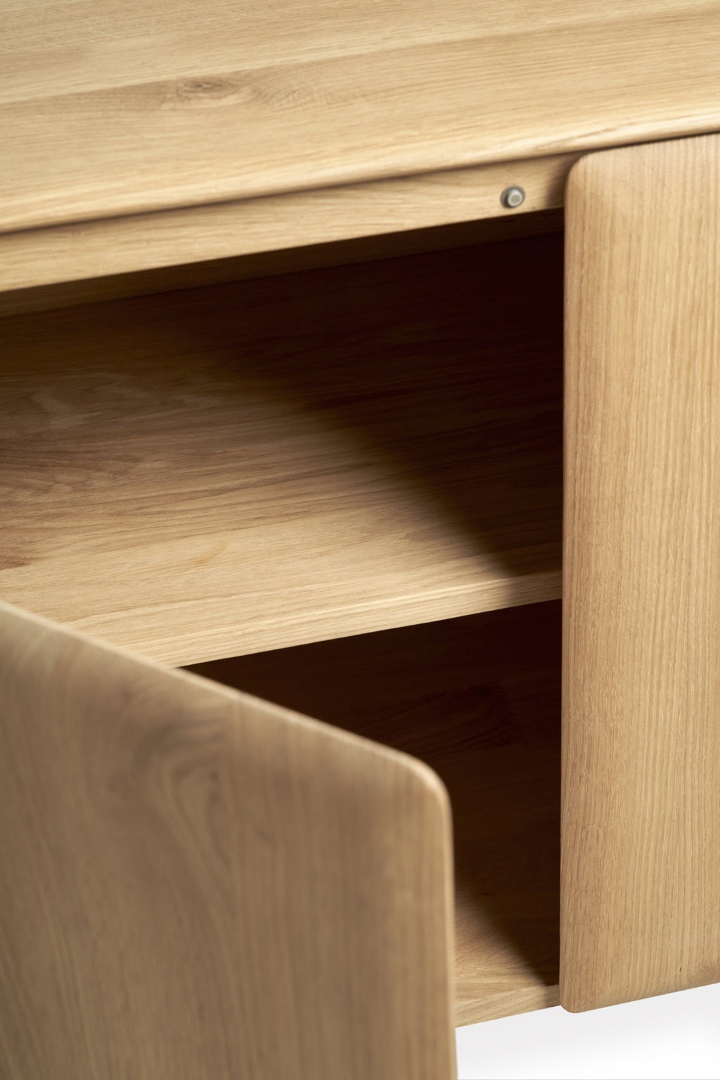 PI Sideboard in white oak with modern silhouette and curved edges for stylish storage
