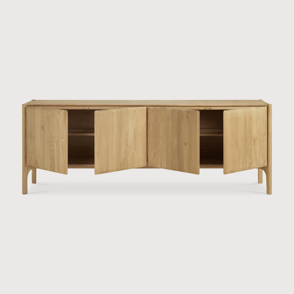 PI Sideboard in white oak with modern silhouette, sculpted base, and curved edges for stylish storage
